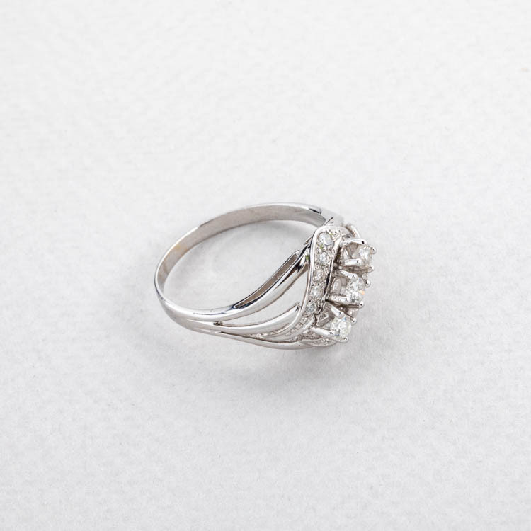 Asymmetric pattern ring with natural diamonds